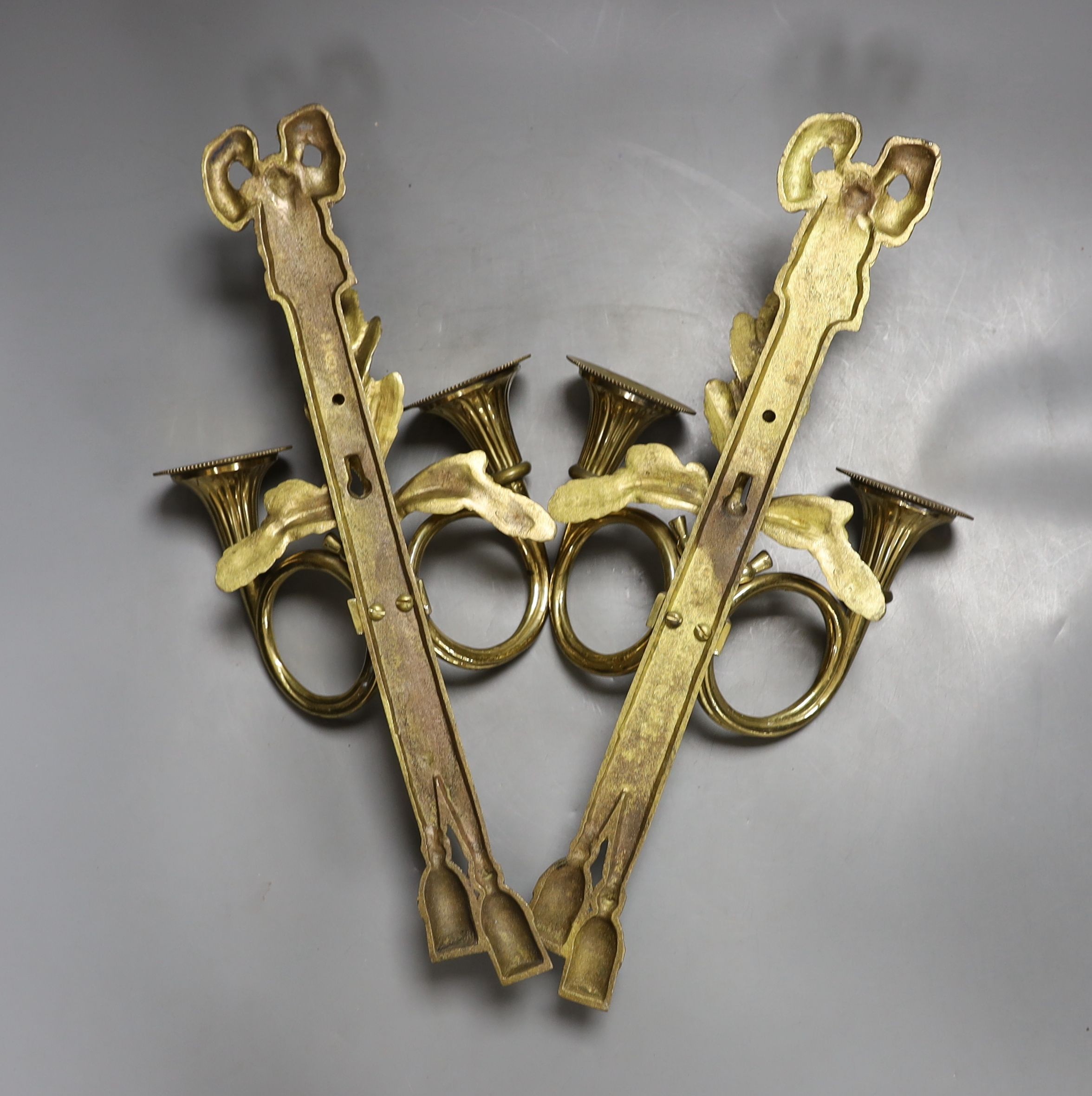 A pair of cast brass twin light wall sconces 40cm